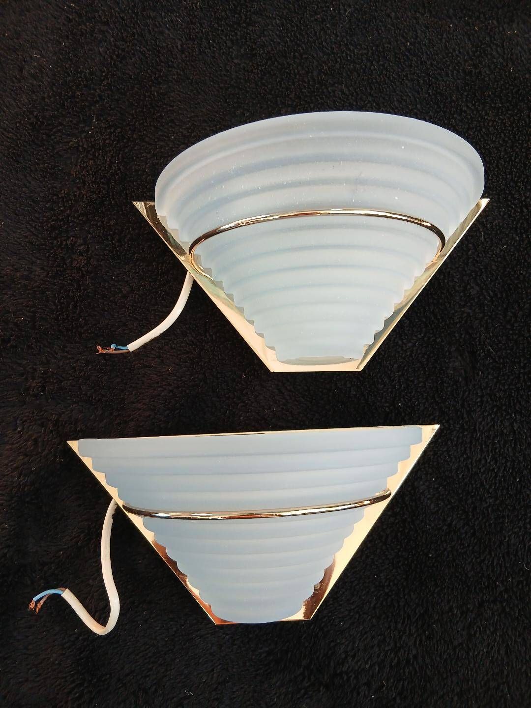 Art Deco wall lights in glass and gilded metal.