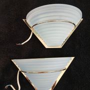 Art Deco wall lights in glass and gilded metal.