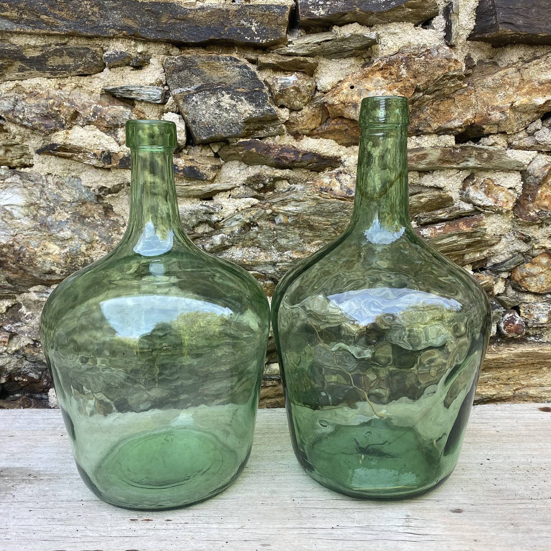 set of tinted glass demijohns