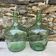 set of tinted glass demijohns