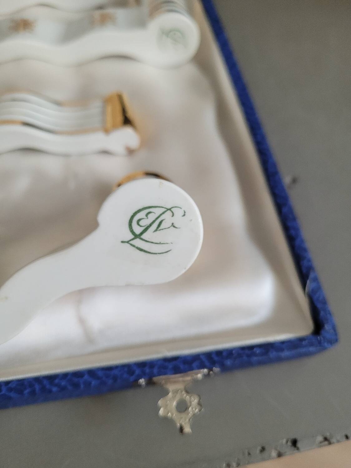 12 Limoges art porcelain knife rests in their case