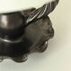 Lampe en céramique noire formant bougeoir