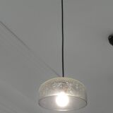 Modern suspended lamp in cracked blown glass, minimalist design.