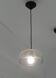 Modern suspended lamp in cracked blown glass, minimalist design.