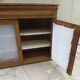 Antique wooden sideboard, fabric doors and pearl grey shelves.