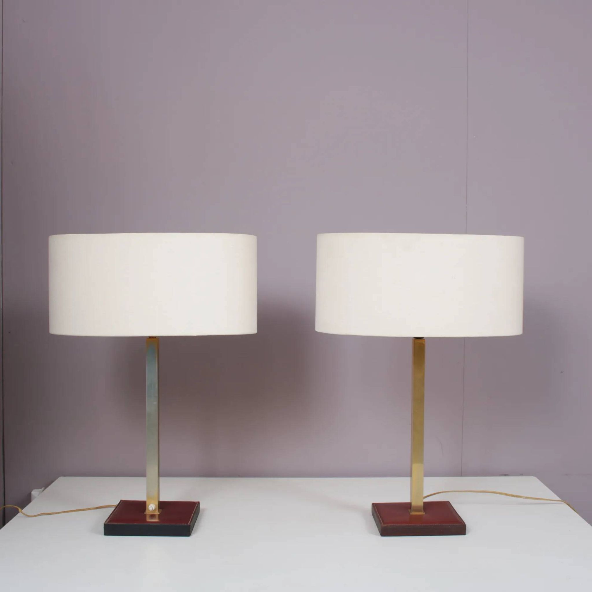 Pair of leather and brass table lamps from the 1960s, originating from Belgium.