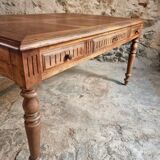 Antique French walnut table with six drawers, parquet top, early 20th century.
