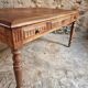 Antique French walnut table with six drawers, parquet top, early 20th century.