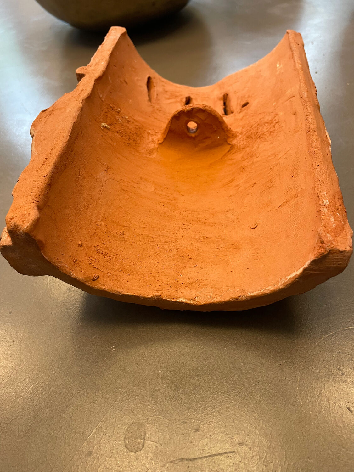 Terracotta sculpture wall light