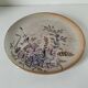 Stoneware plate with hand-painted floral decoration
