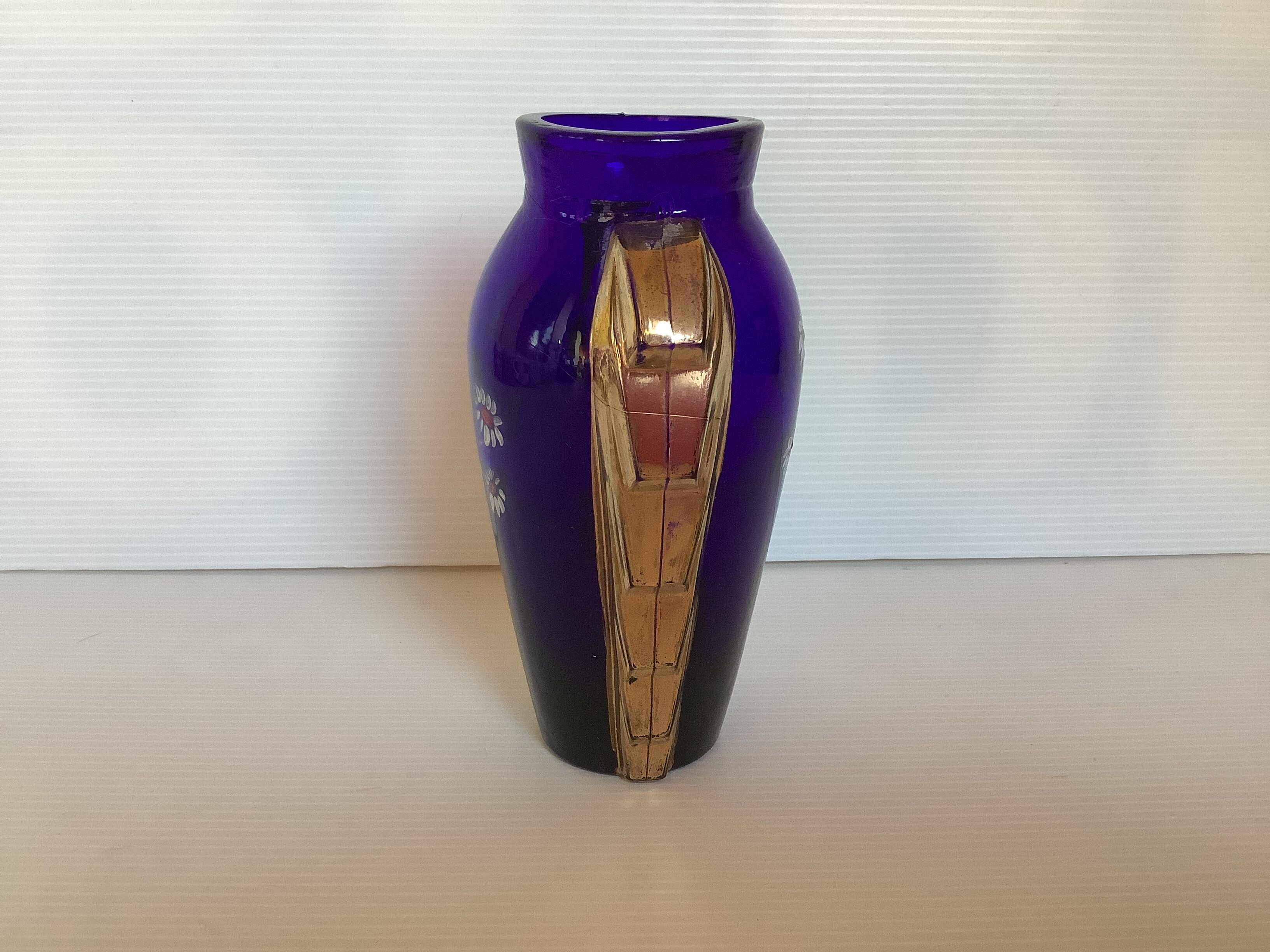 Antique blue and gold glass vase with flower pattern