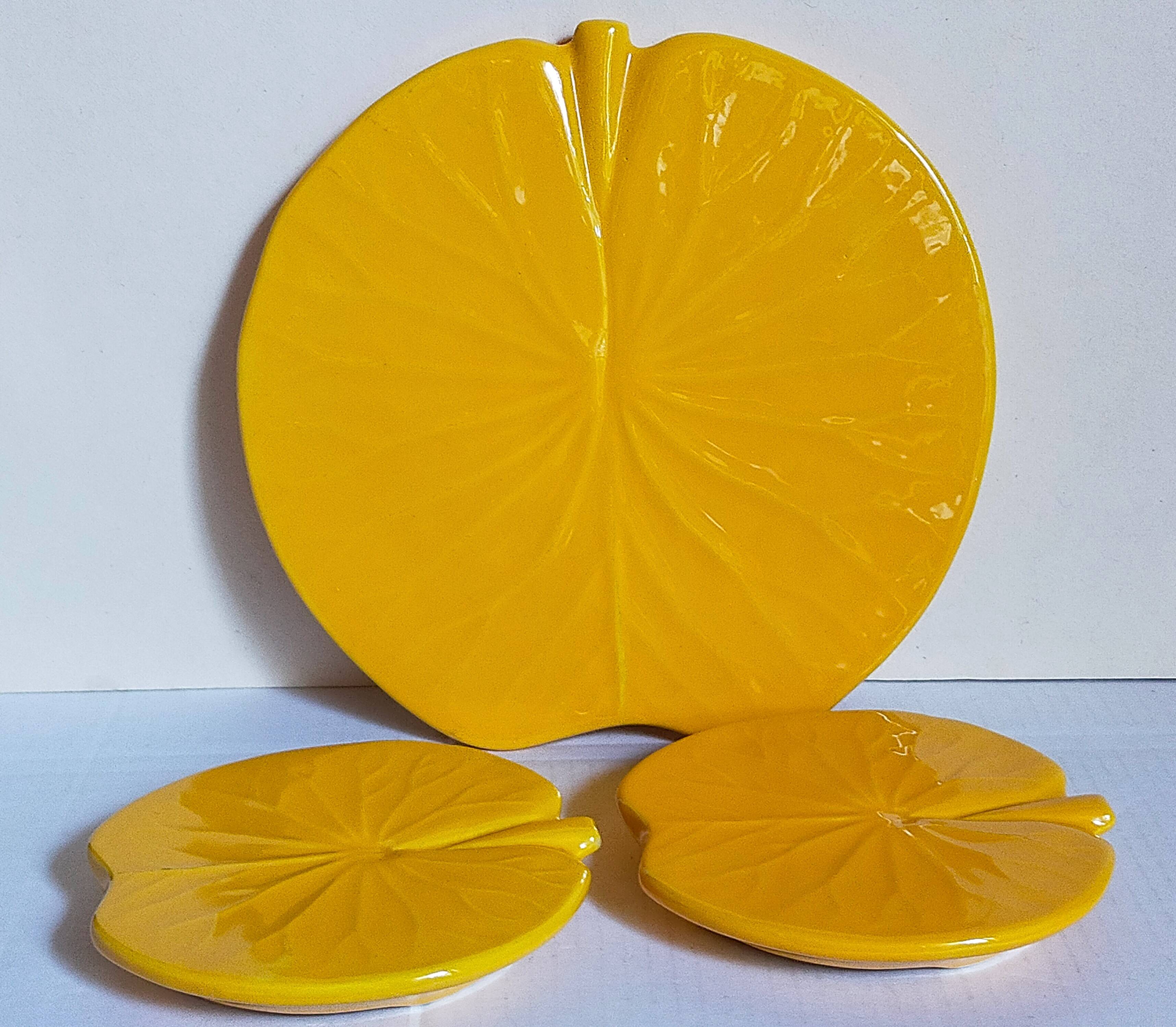 Three vintage water lily presentation dishes in slip