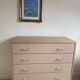 Pink tapered leg chest of drawers