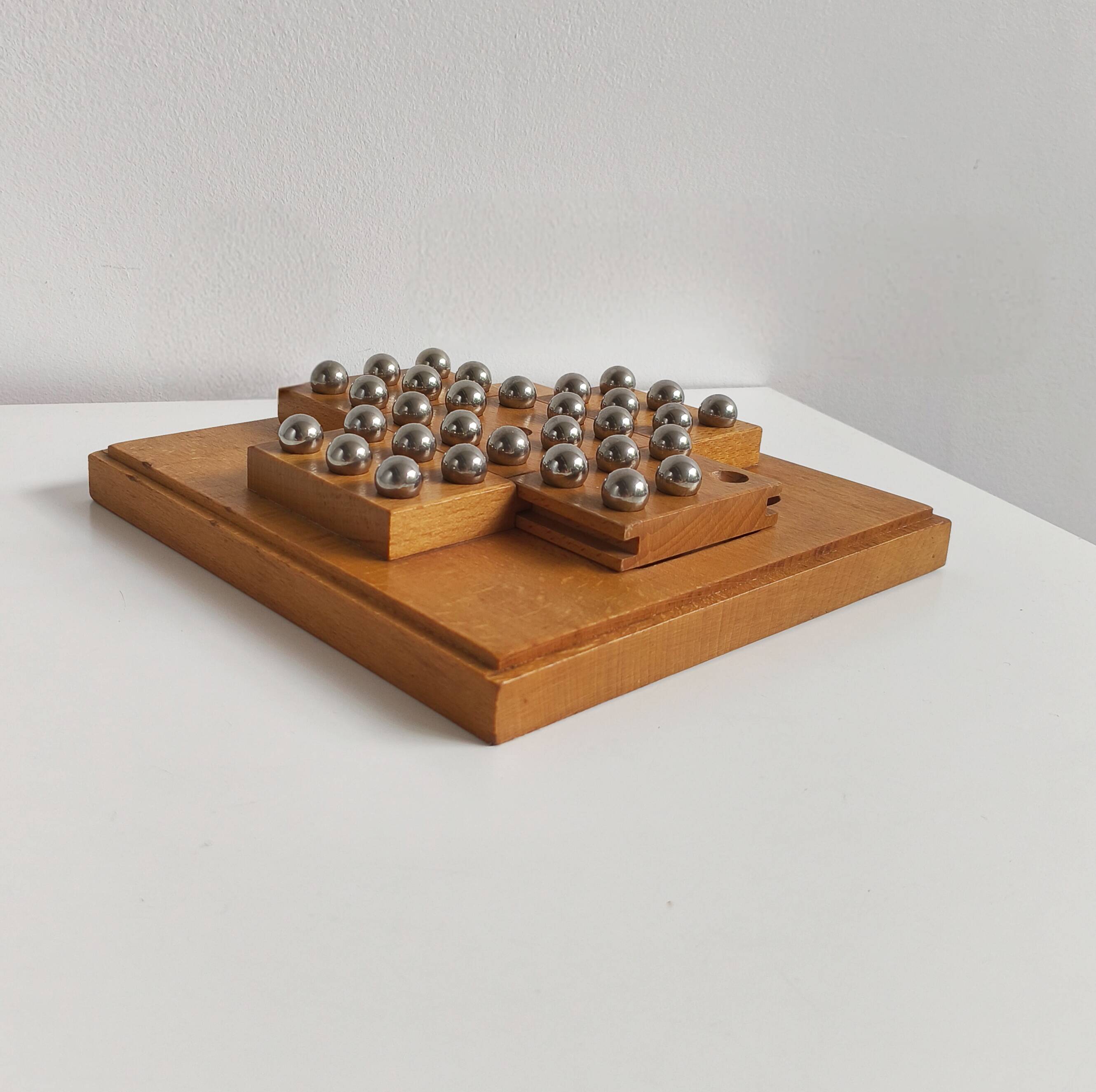 Solid wood and chrome steel solitaire game