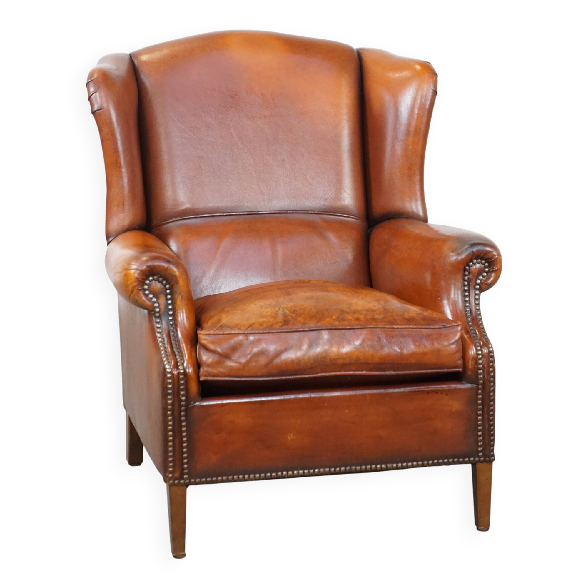 Sheepskin leather wingback chair with patina