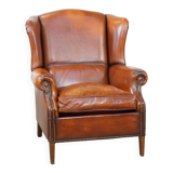 Sheepskin leather wingback chair with patina