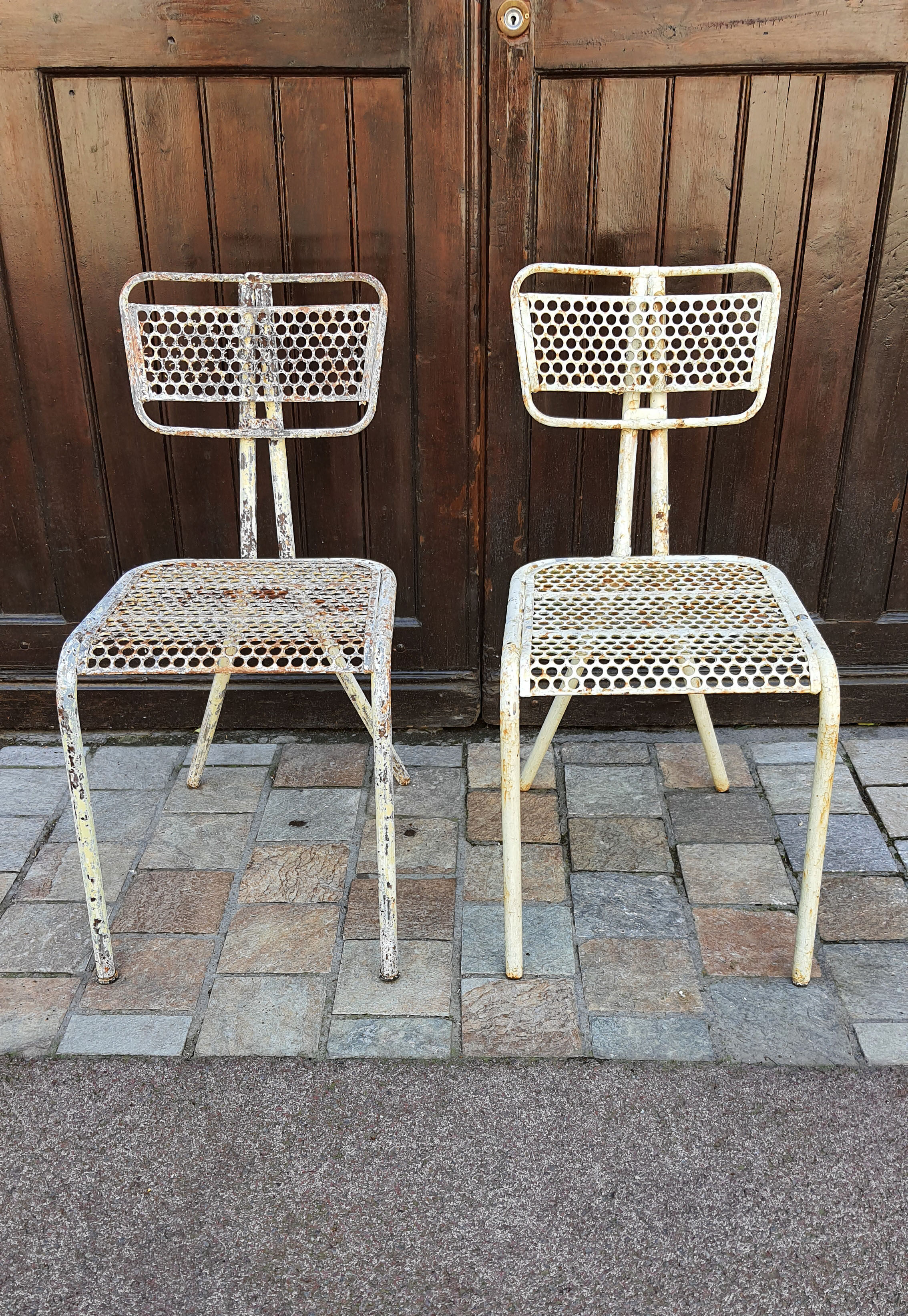 Perforated metal chairs René Malaval 1950