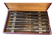 Service of 24 Art Deco knives with wooden handles and engraved metal ferrules from 1930.