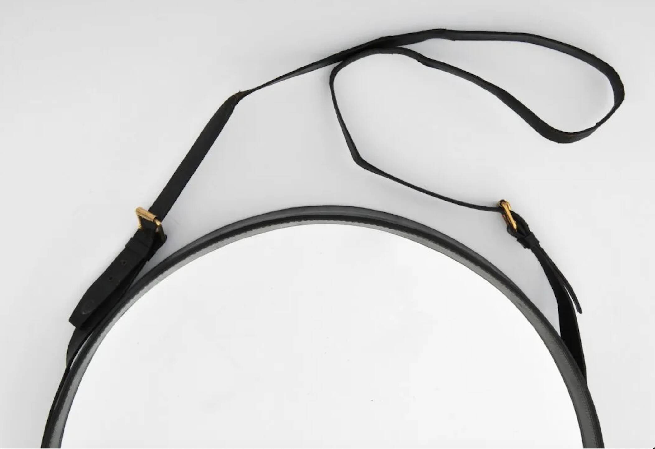 Jacques Adnet pair of circular leather and brass mirrors