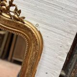 Miroir de style Louis XV en bois et stuc doré XX siècle