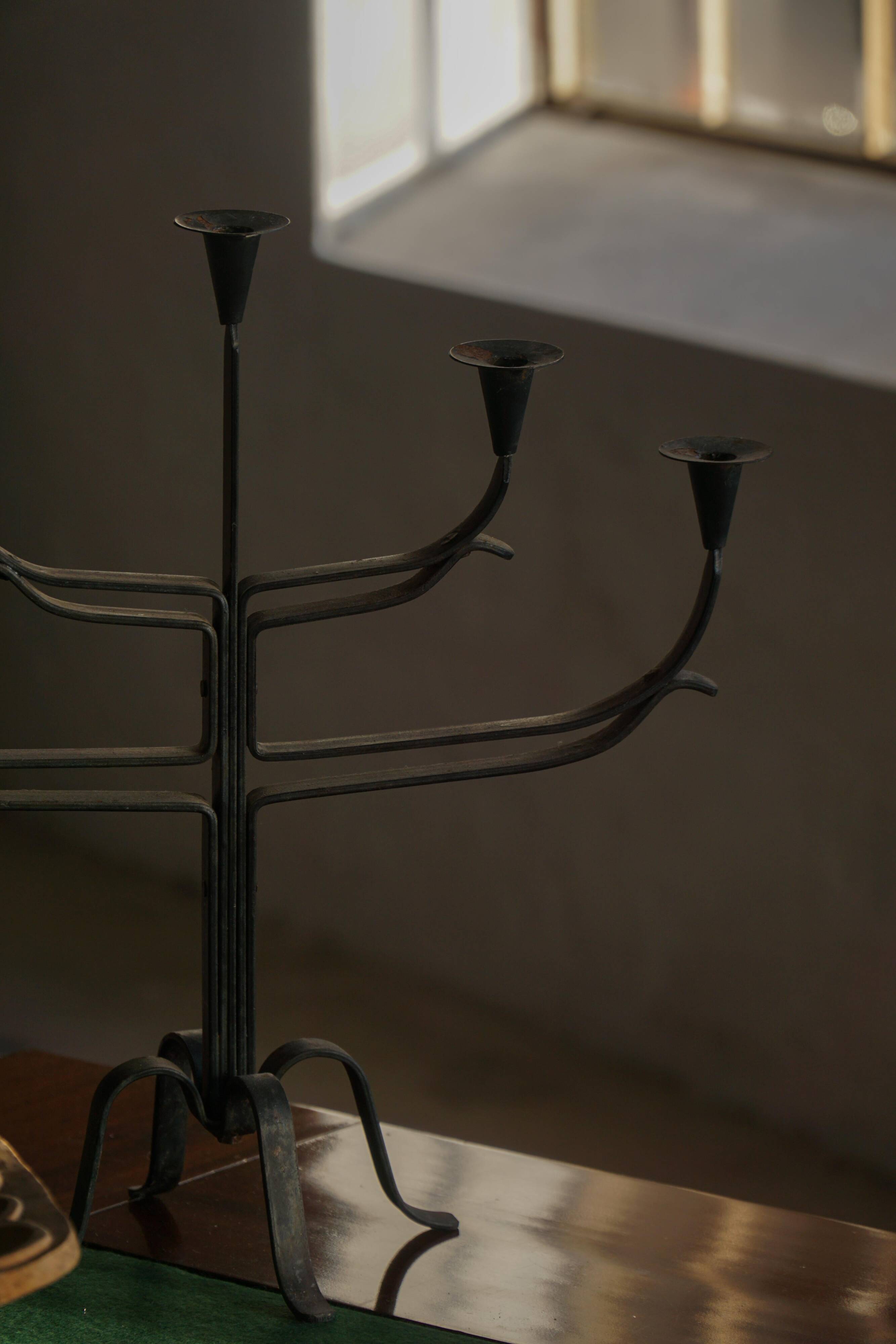 Brutalist Scandinavian candlestick in wrought iron and metal from the mid-20th century.