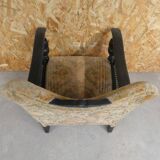Old armchair upholstered in velvet, carved and caned wood