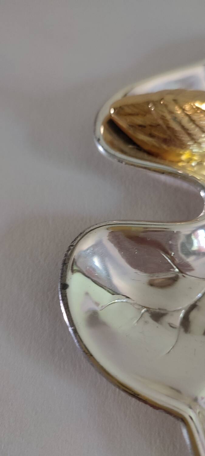 A Lancel pocket tray in silver metal.