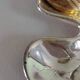 A Lancel pocket tray in silver metal.