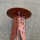Round folding side table made of carved solid wood.