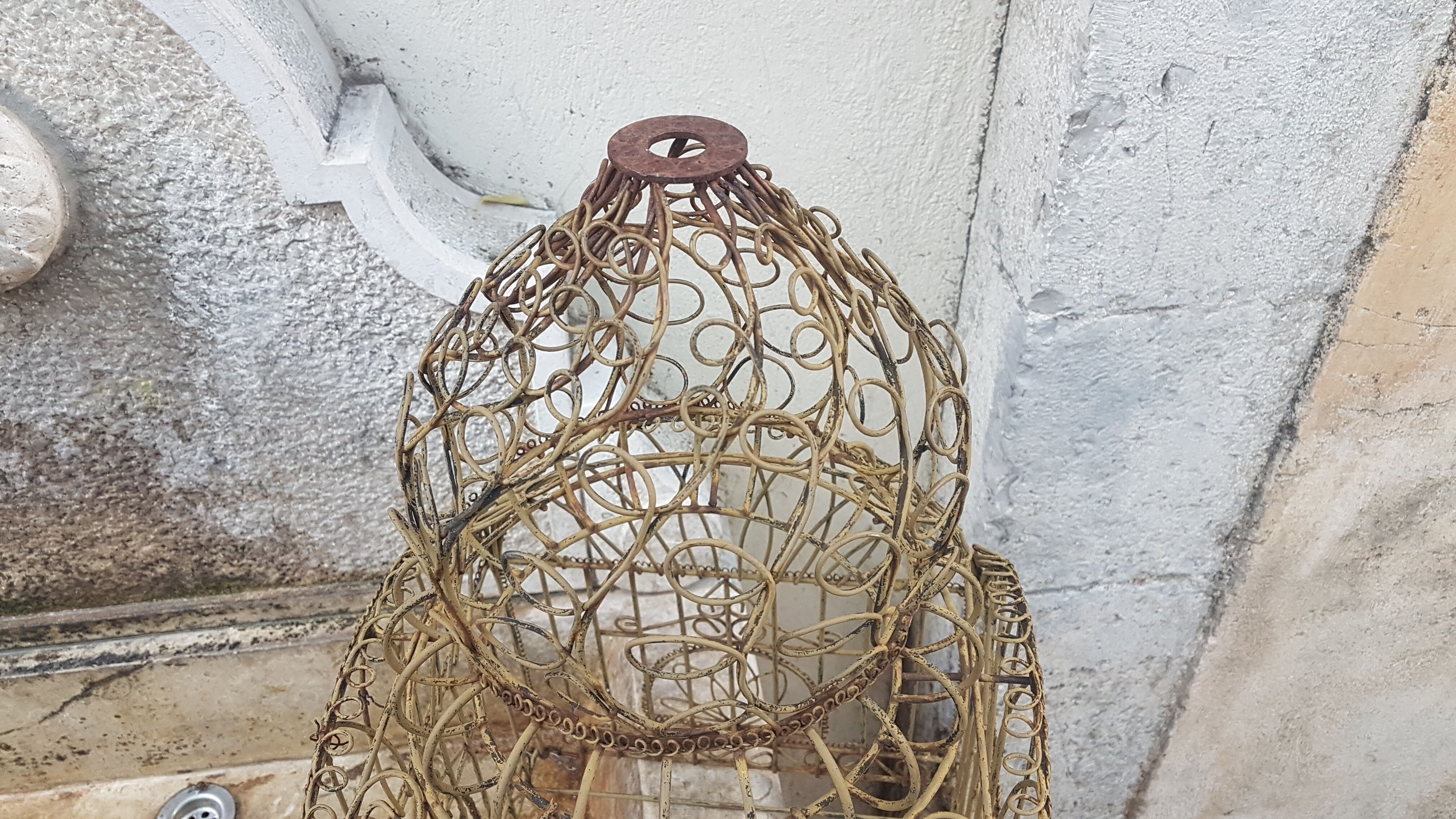 Painted old-bird cage in scrap