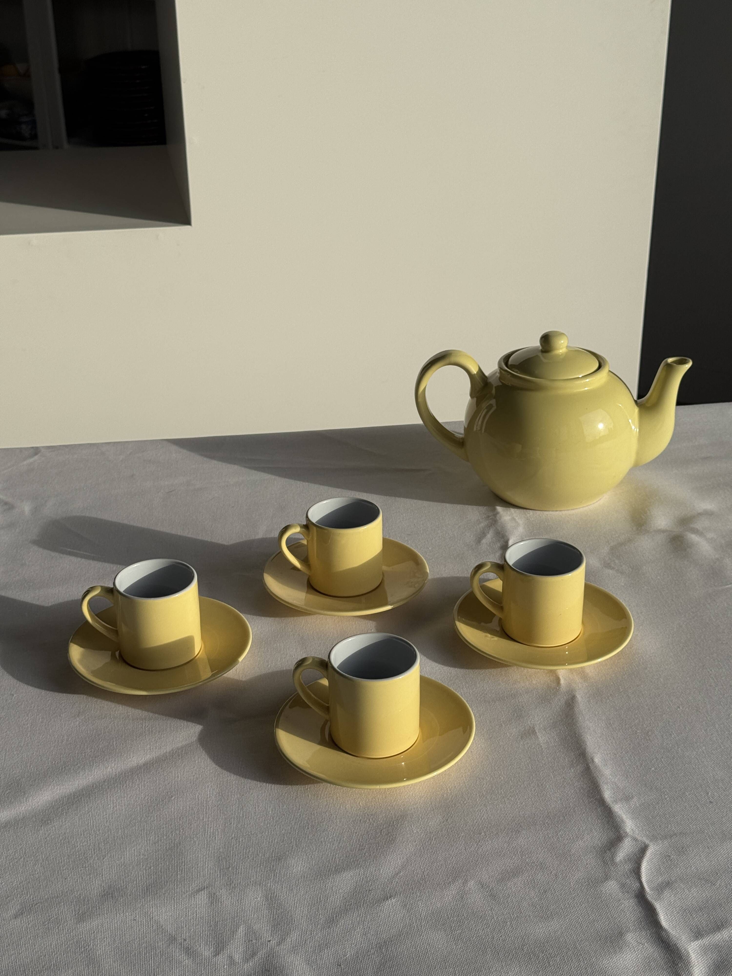 Set of 4 vintage yellow Italian espresso cups and saucers.