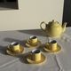Set of 4 vintage yellow Italian espresso cups and saucers.