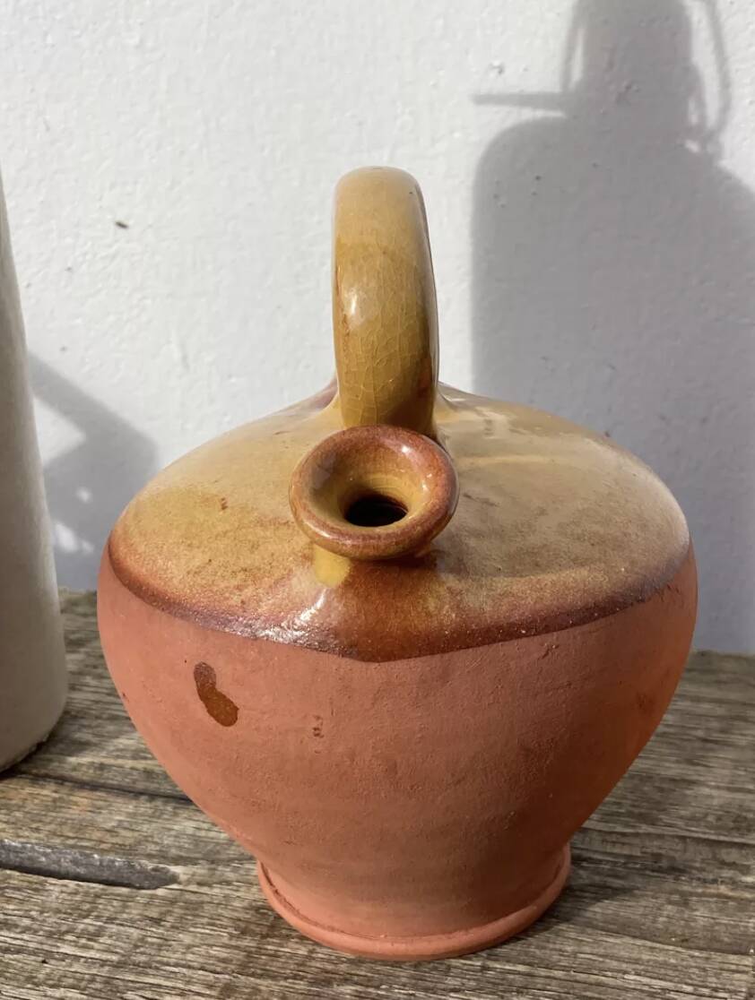 Gargoulette or old jug in yellow glazed terracotta