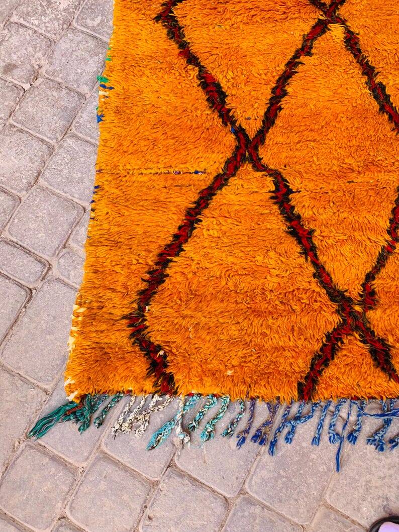 Beni oren art rug, handmade moroccan rug, yellow black red rug, abstract yellow rug.