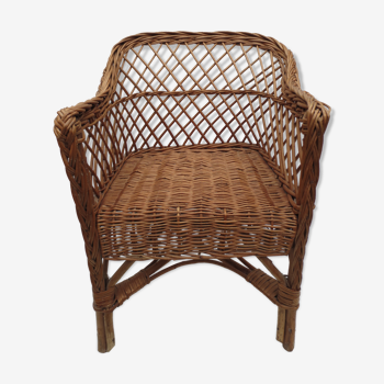 Old wicker armchair for children