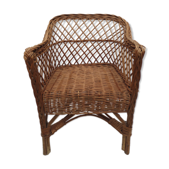 Old wicker armchair for children