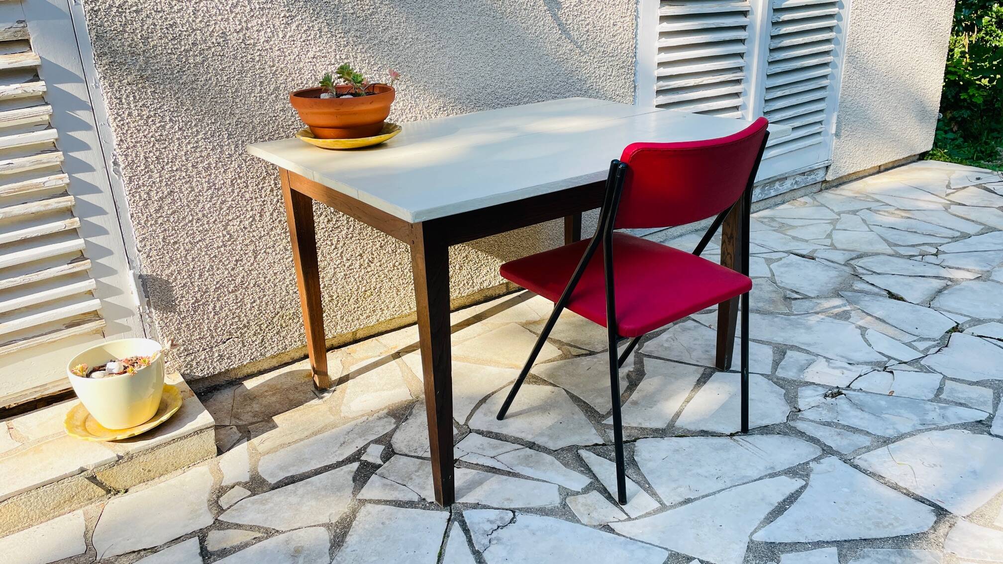 Vintage oak farmhouse table with a white top.
