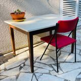 Vintage oak farmhouse table with a white top.