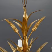 Golden suspension on ears of wheat, circa 1960