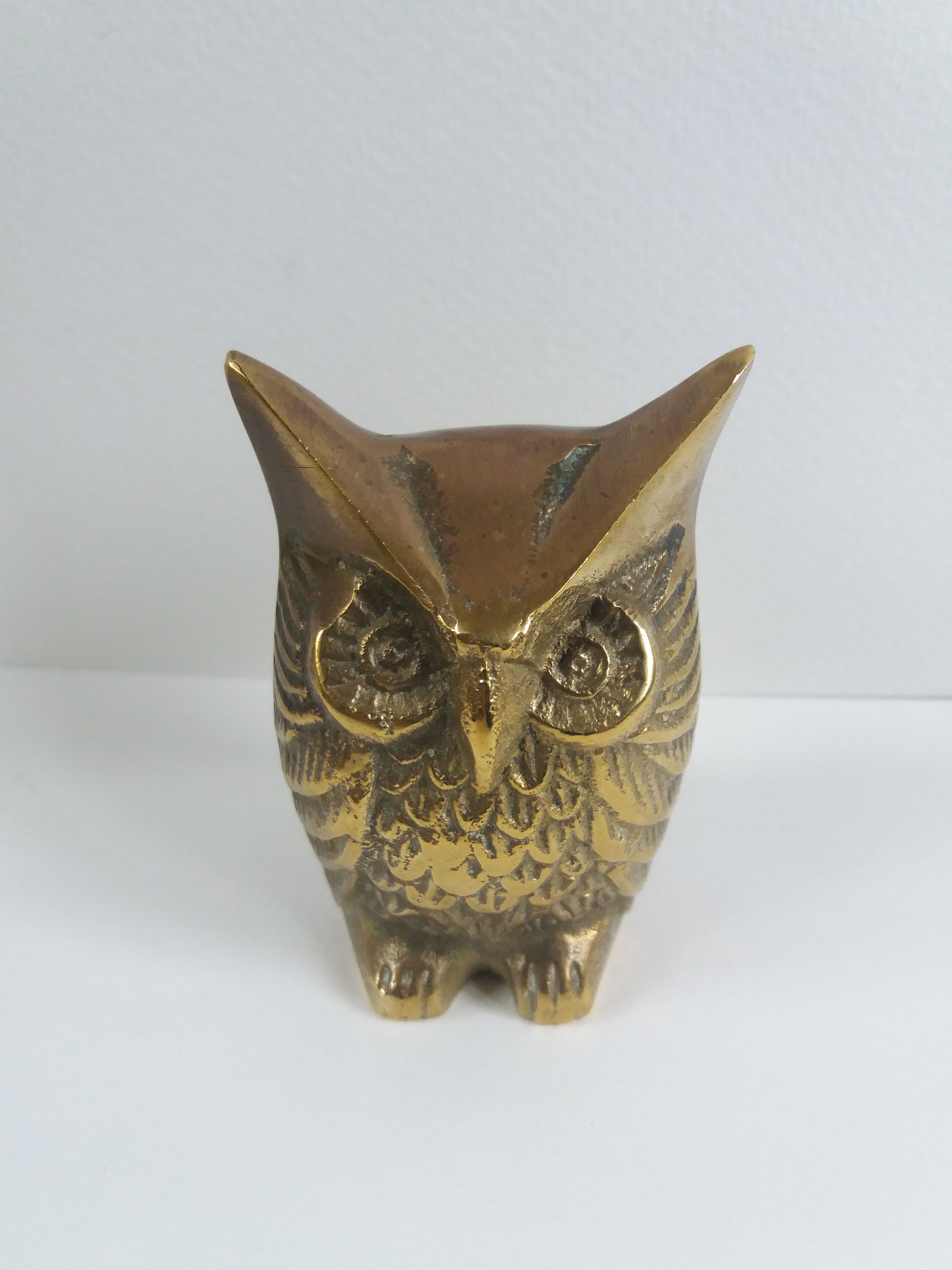 Chiseled brass owl