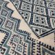 White and blue hand-woven rug in natural wool