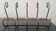 Old wall-mounted wrought iron coat rack