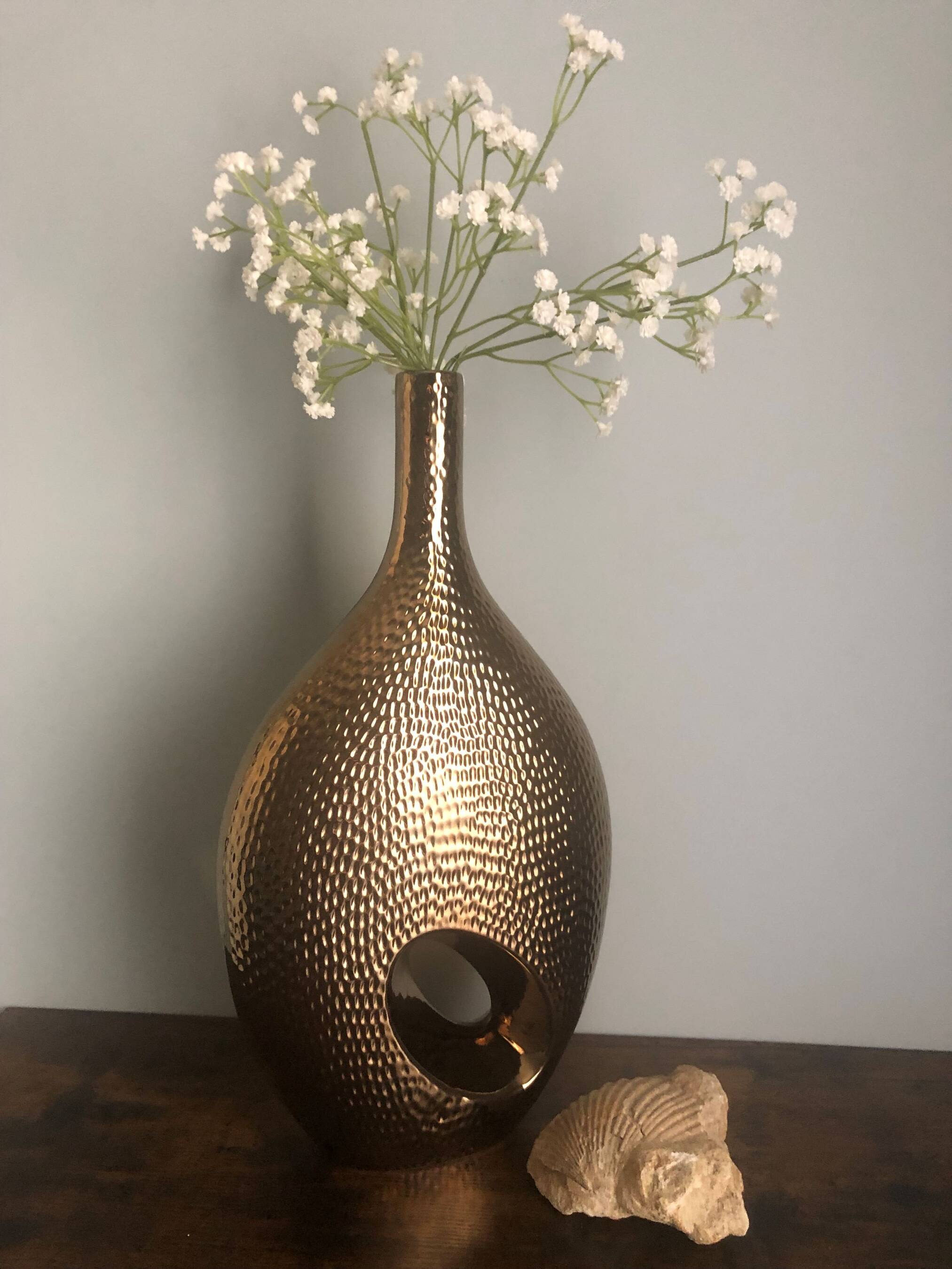 Golden ceramic vase.