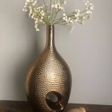 Golden ceramic vase.