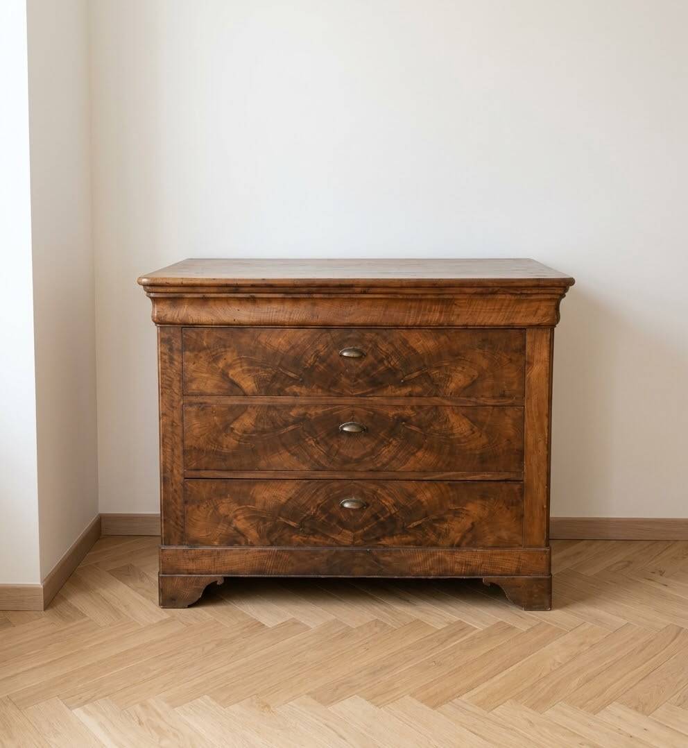 Antique walnut chest of drawers with three drawers.