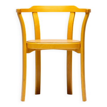 Stackable chairs in curved beech.