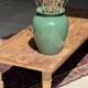 Brown Indonesian teak coffee table, with a border and cylindrical legs H40 L103.
