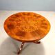 Antique round walnut table with a baluster central leg, Italy, 19th century.