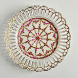 Pair of openwork porcelain plates decorated with roses