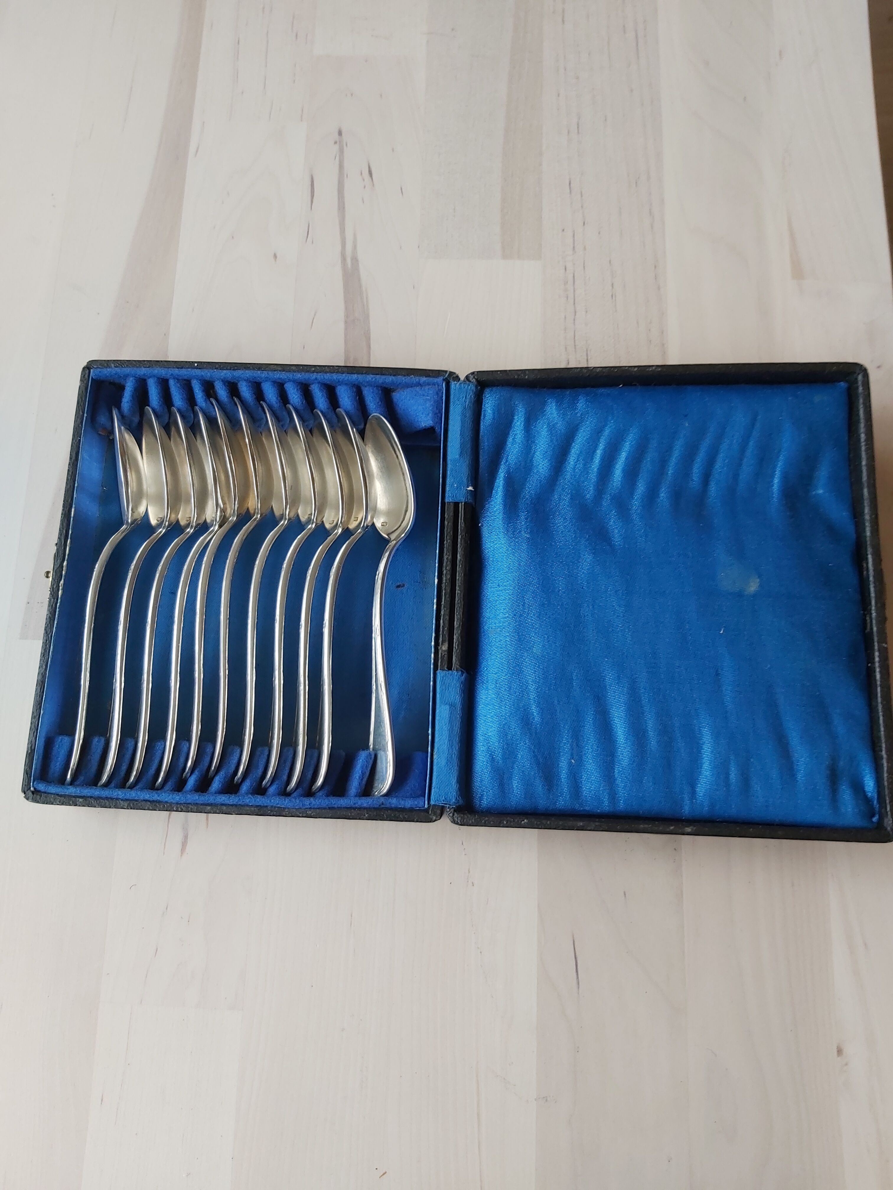 Series of 11 small silver metal spoons